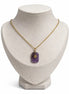dreampunk.arts Aeriselle-Eliyra Starlight pendant featuring a purple amethyst stone with a gold star on a gold chain.