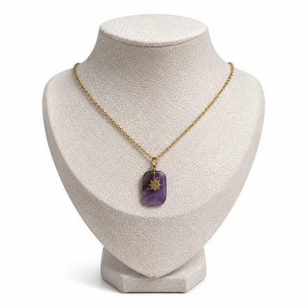 dreampunk.arts Aeriselle-Eliyra Starlight pendant featuring a purple amethyst stone with a gold star on a gold chain.