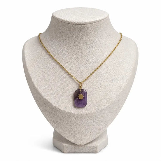 dreampunk.arts Aeriselle-Eliyra Starlight pendant featuring a purple amethyst stone with a gold star on a gold chain.