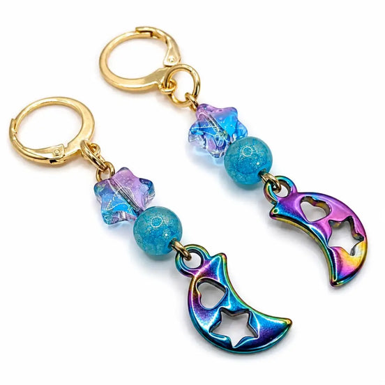 dreampunk.arts gold stainless steel earrings featuring iridescent crescent moon charms and blue star glass beads