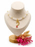 dreampunk.arts Mage the Red Moon necklace with white glass beads, gold moon charm, and red accent on a display bust
