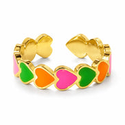 dreampunk.arts Aeriselle Neon Sakura stainless steel ring with colorful enamel heart motifs in pink, orange, and green.