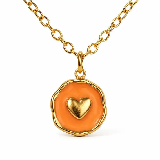 dreampunk.arts gold-plated stainless steel heart pendant necklace with orange enamel on a delicate chain