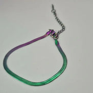 dreampunk.arts rainbow snake chain bracelet with a metallic iridescent finish and adjustable clasp