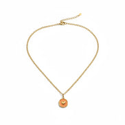 Orangefarbener Herzanhänger mit goldener Edelstahlkette